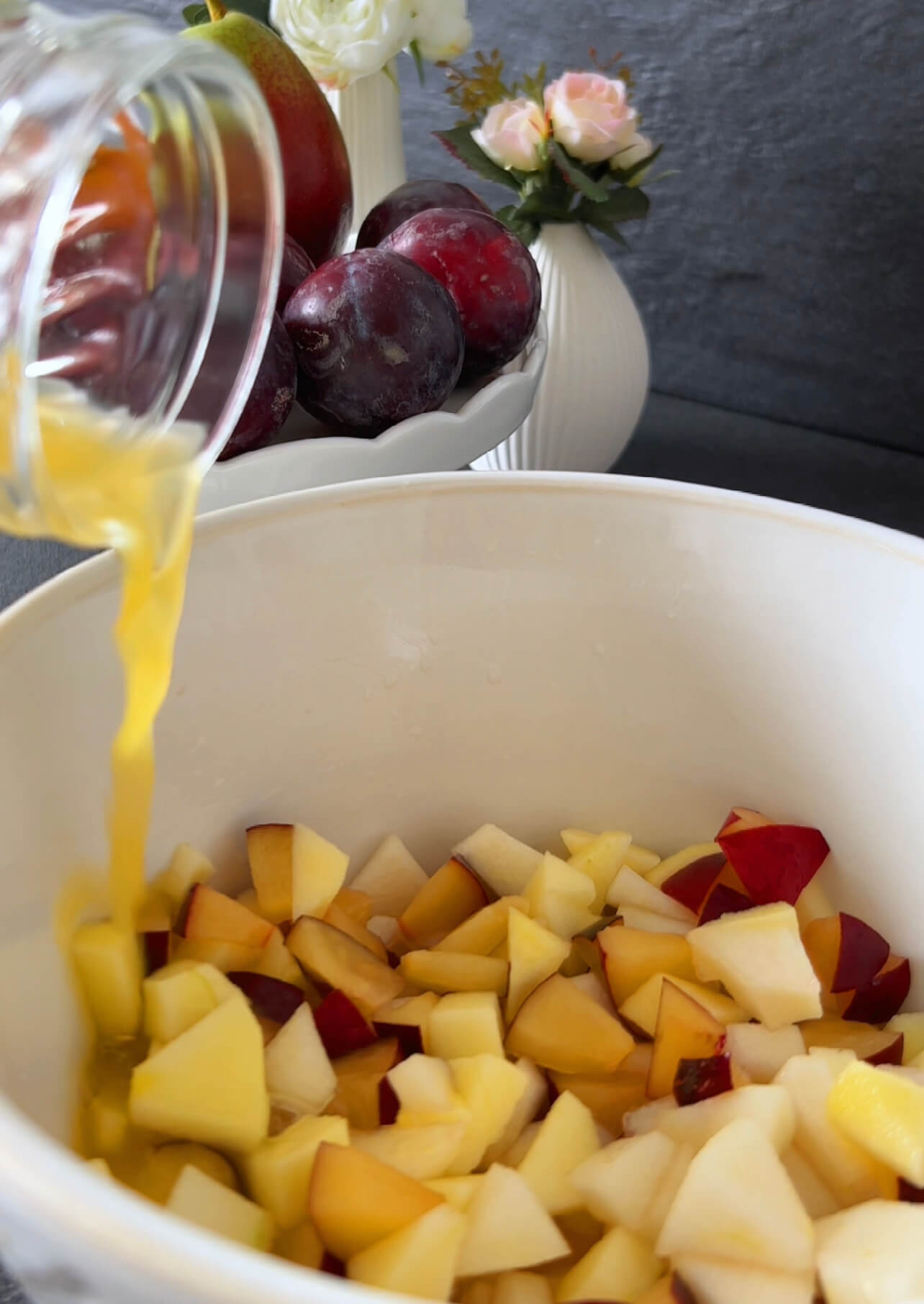 Image of Pour the orange juice over the fruit and gently mix.