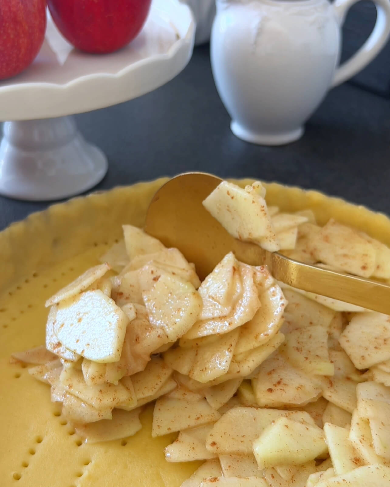 Image of Place the apple mixture into the lined dough.