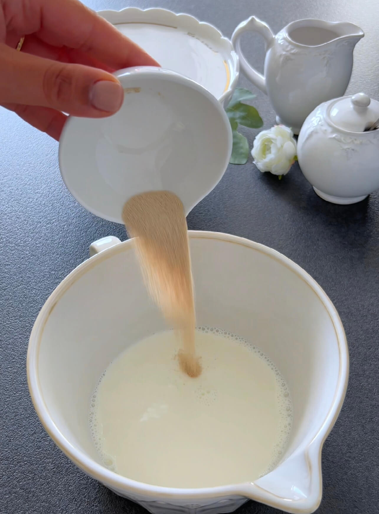 Image of In a large bowl, mix milk and yeast. Add sugar,...