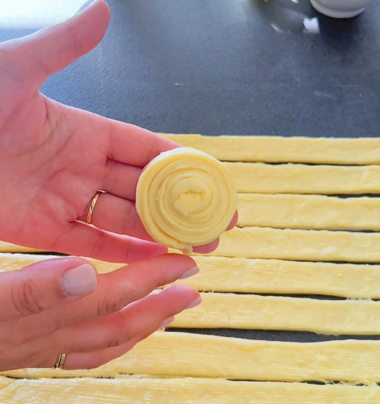 Image of Place the shaped rolls on a baking sheet lined with...