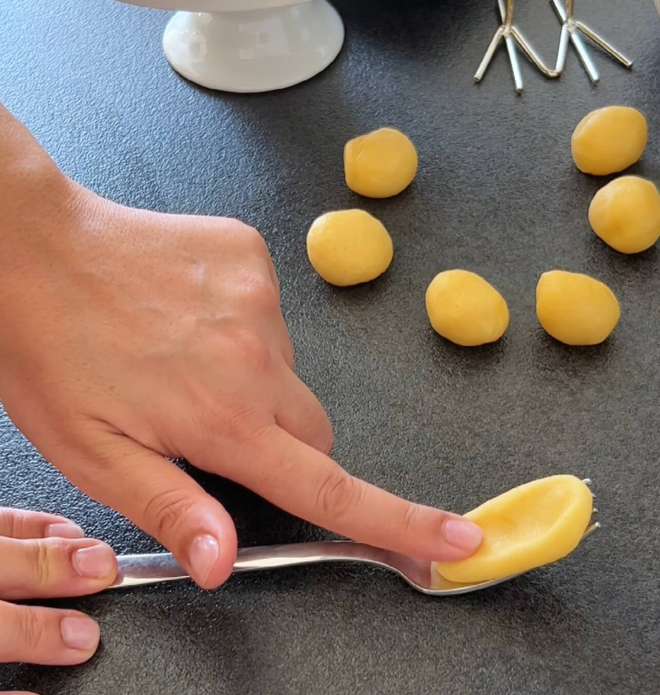 Image of Flatten each portion into a disc on a fork.