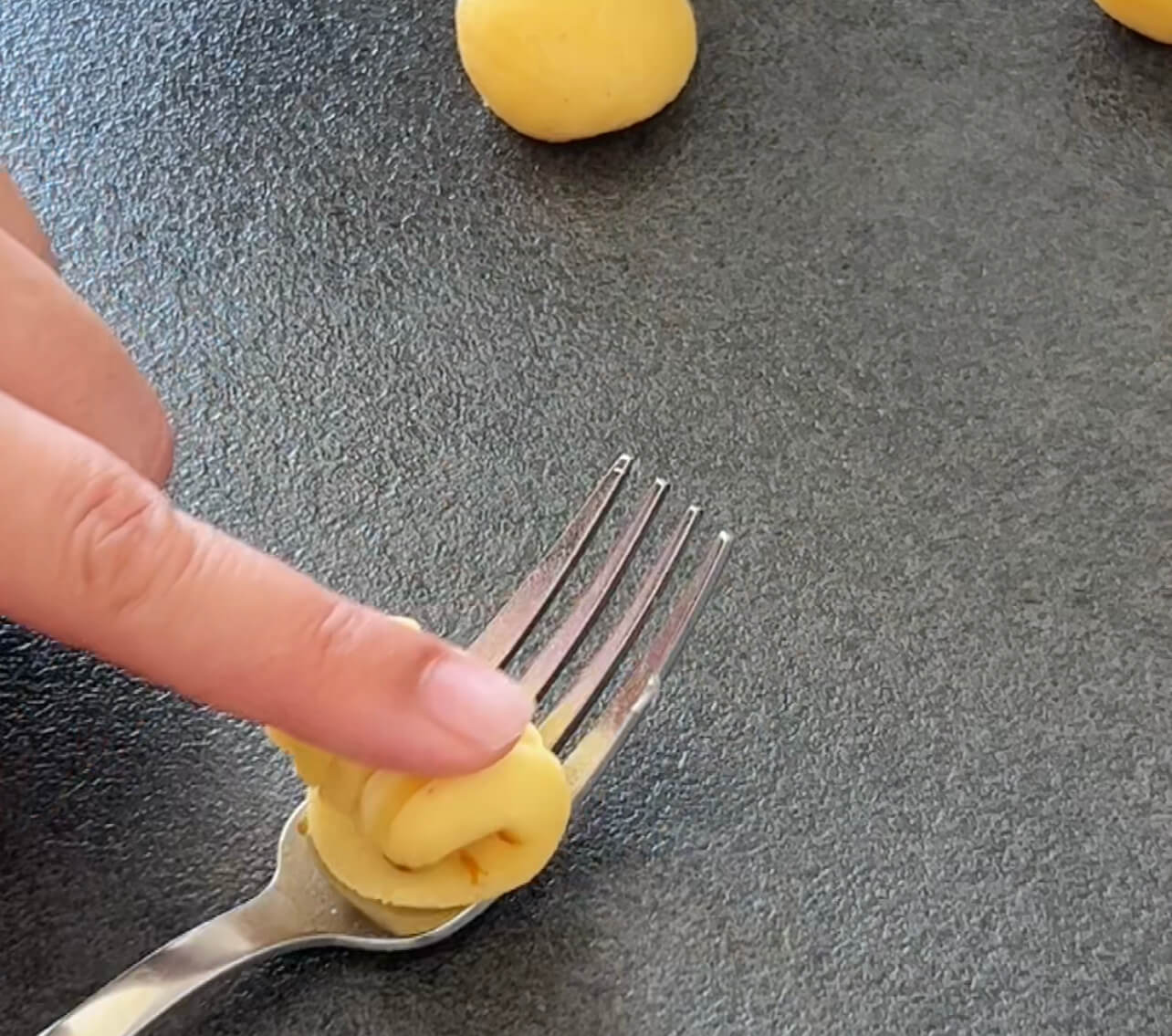 Image of Fold the dough over the filling using the fork, pressing...