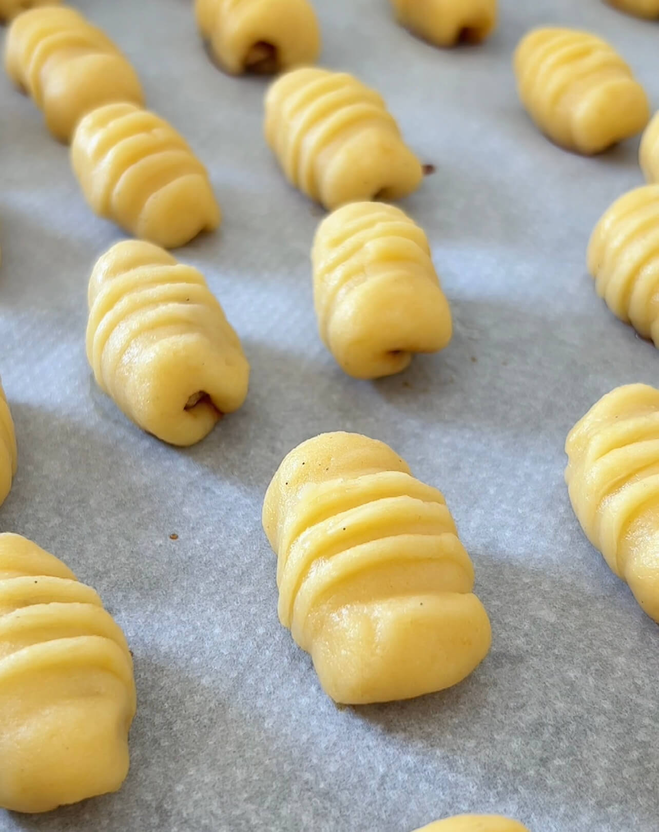 Image of Place the filled cookies on a baking sheet lined with...