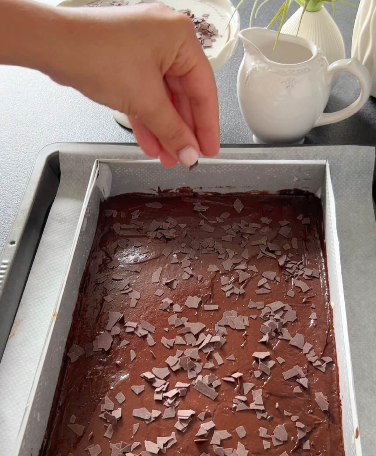 Image of Pour the batter into the prepared baking pan, spreading it...