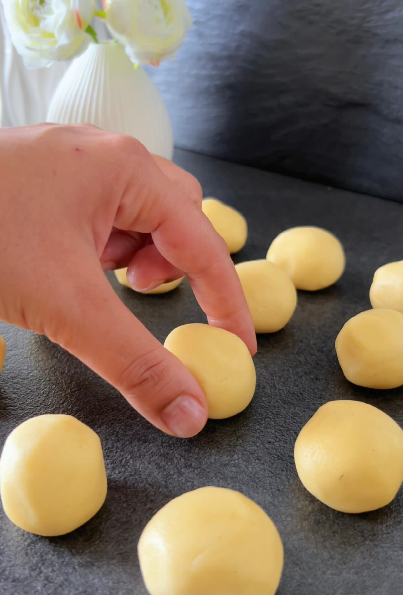 Image of Shape the dough into approximately 19 small balls, about 20...