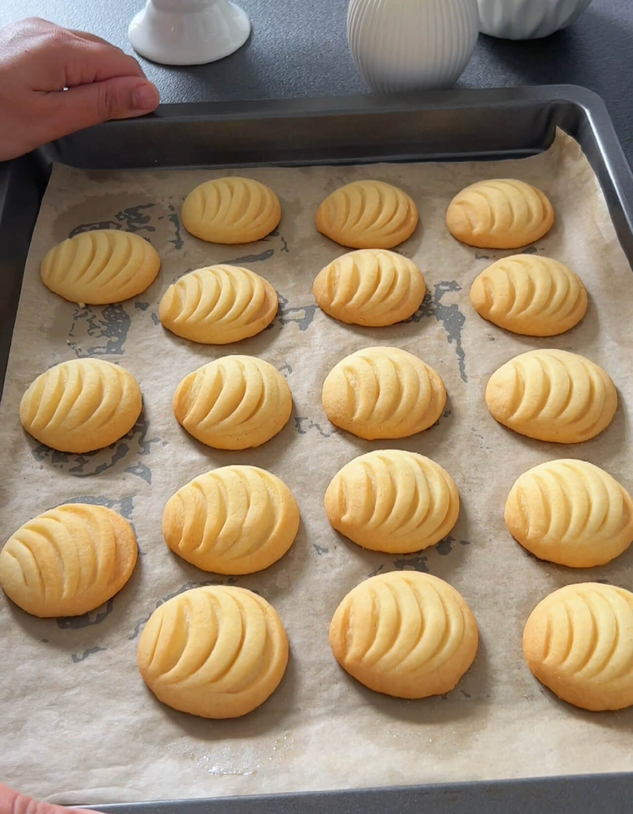 Image of Place the shaped cookies on a baking sheet lined with...