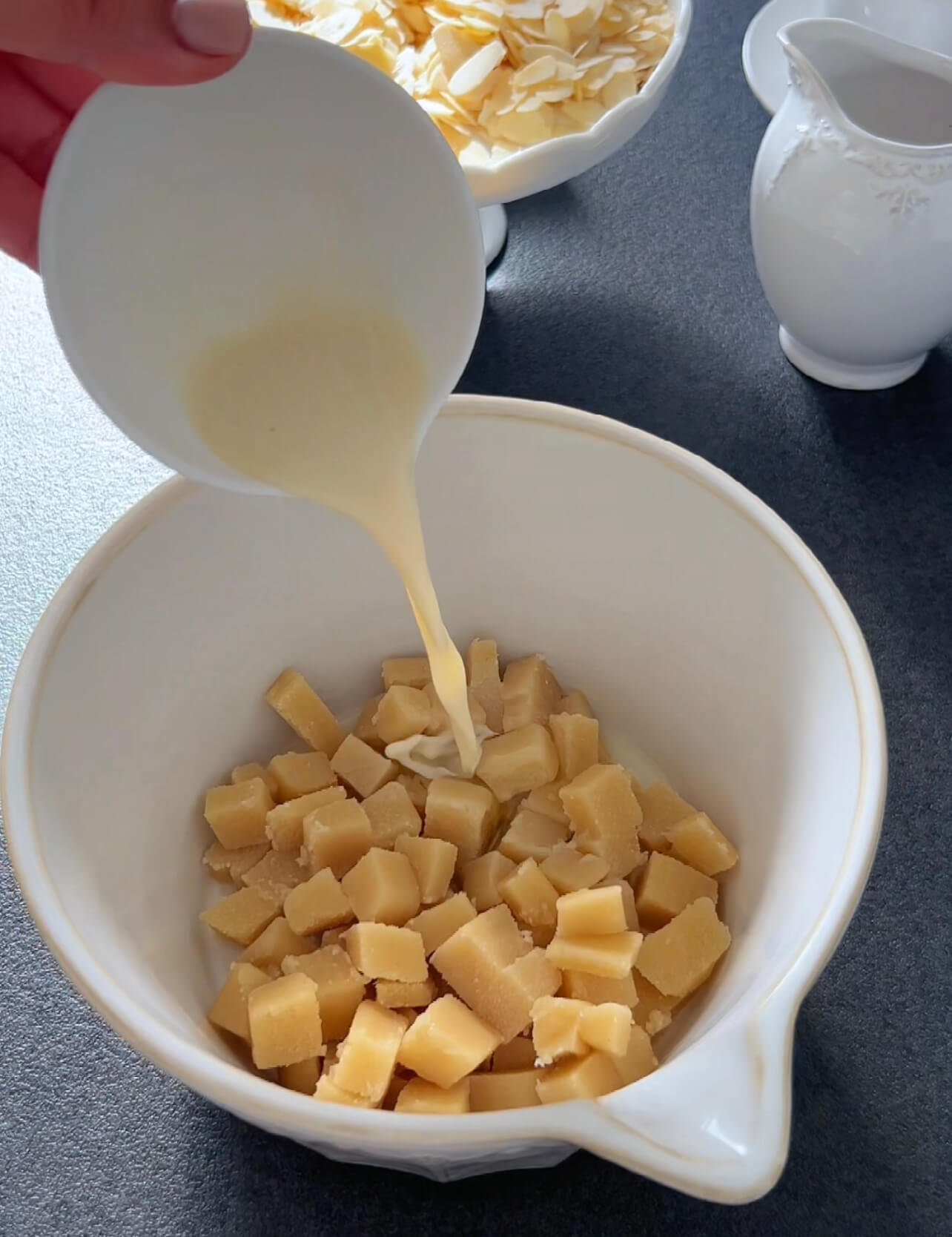 Image of In another bowl, combine the diced marzipan, almond milk, bitter...