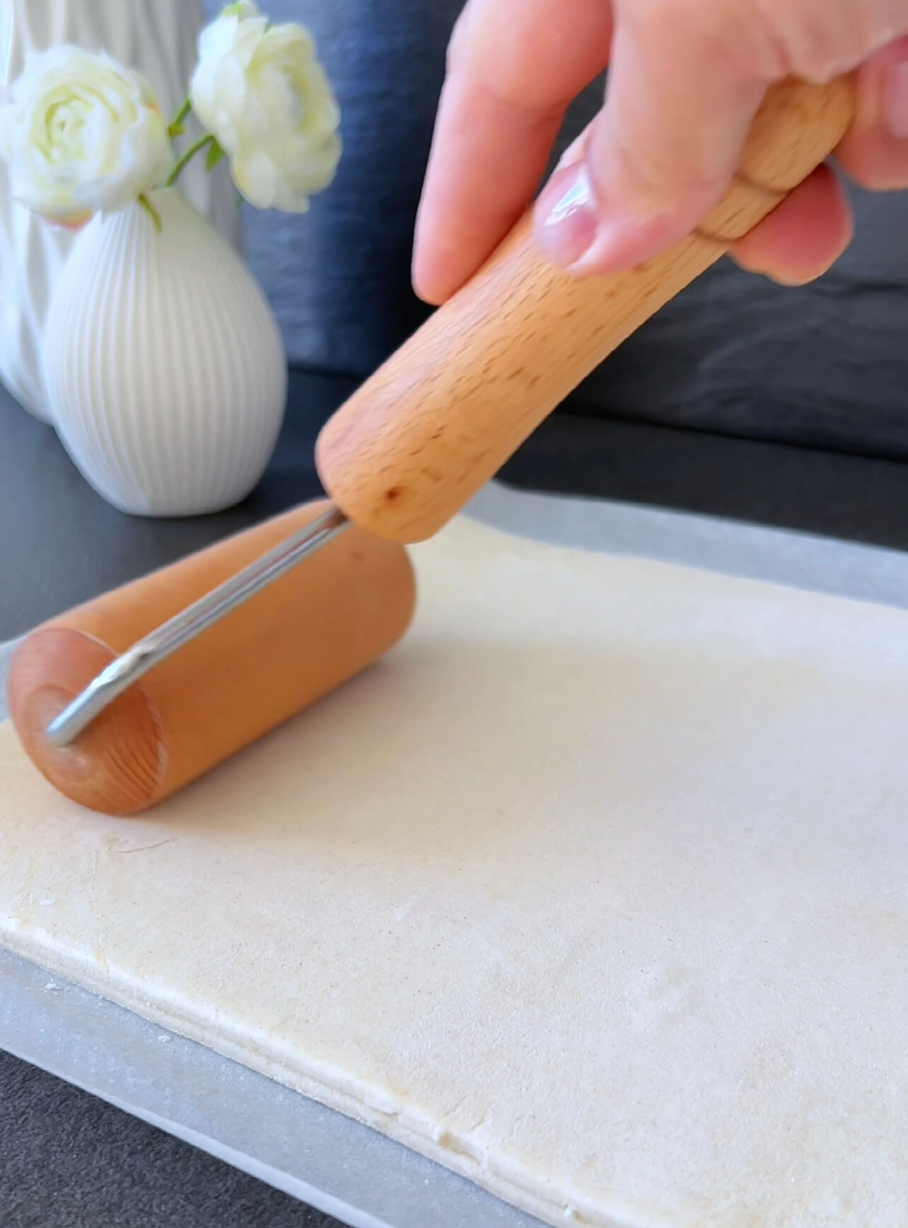 Image of Stack puff pastry rolls and roll them out.