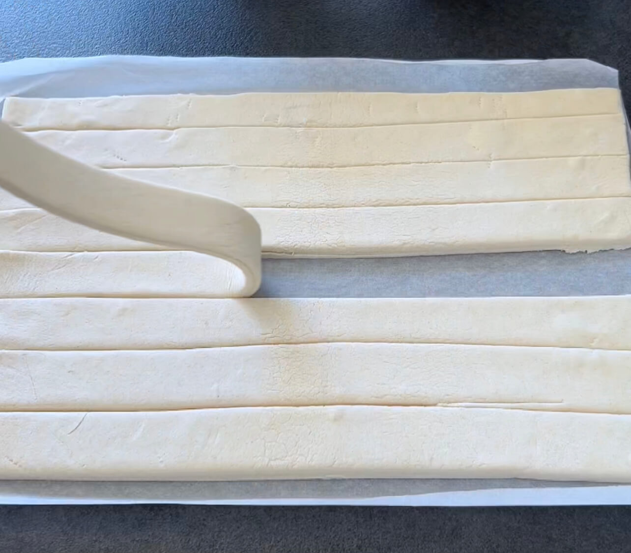 Image of Place on a parchment-lined baking sheet.