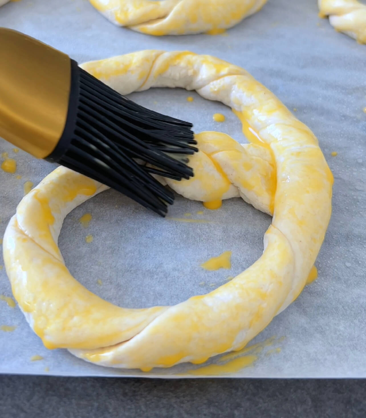 Image of Brush them with a mixture of one egg yolk and...