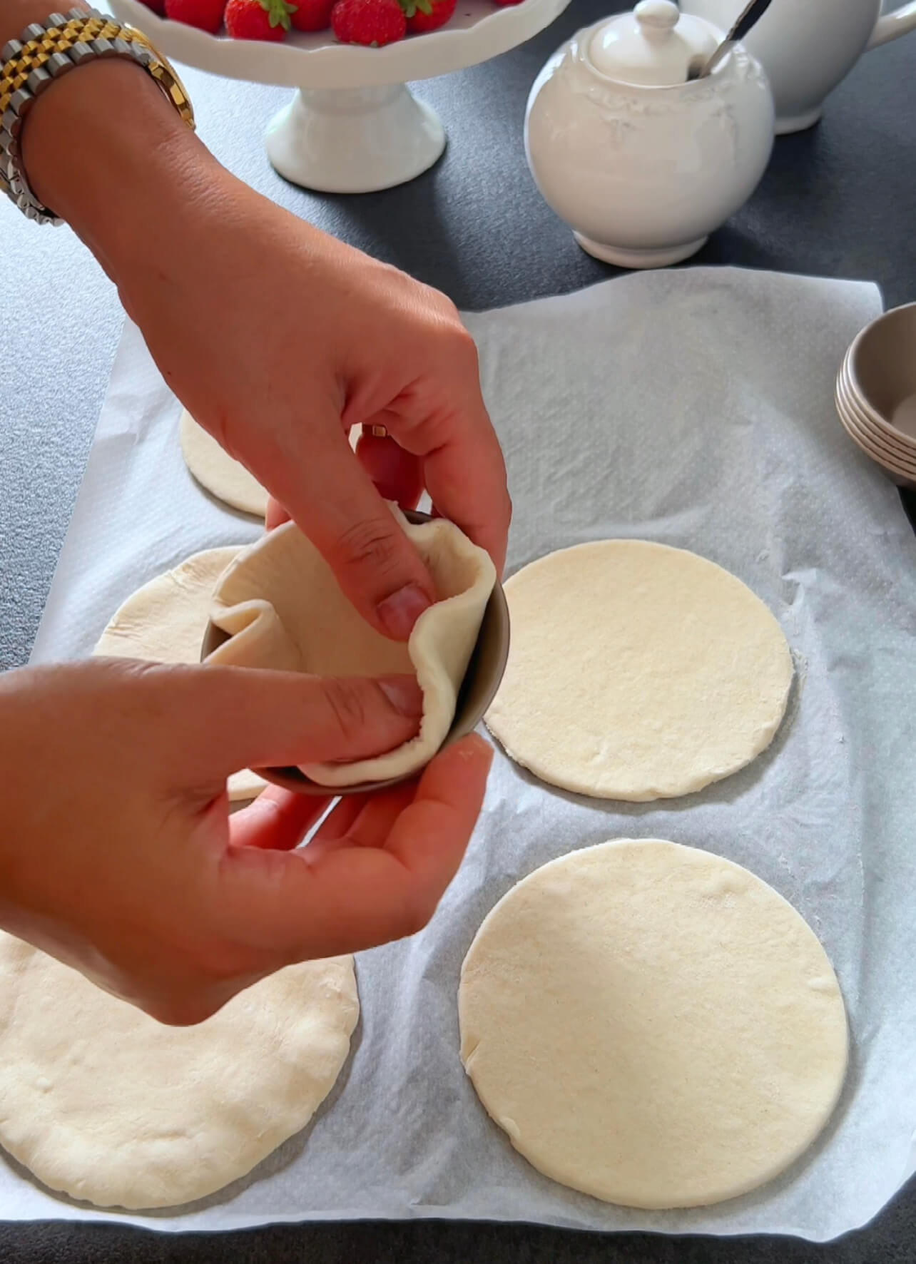 Image of Place each puff pastry circle into a small tart mold...