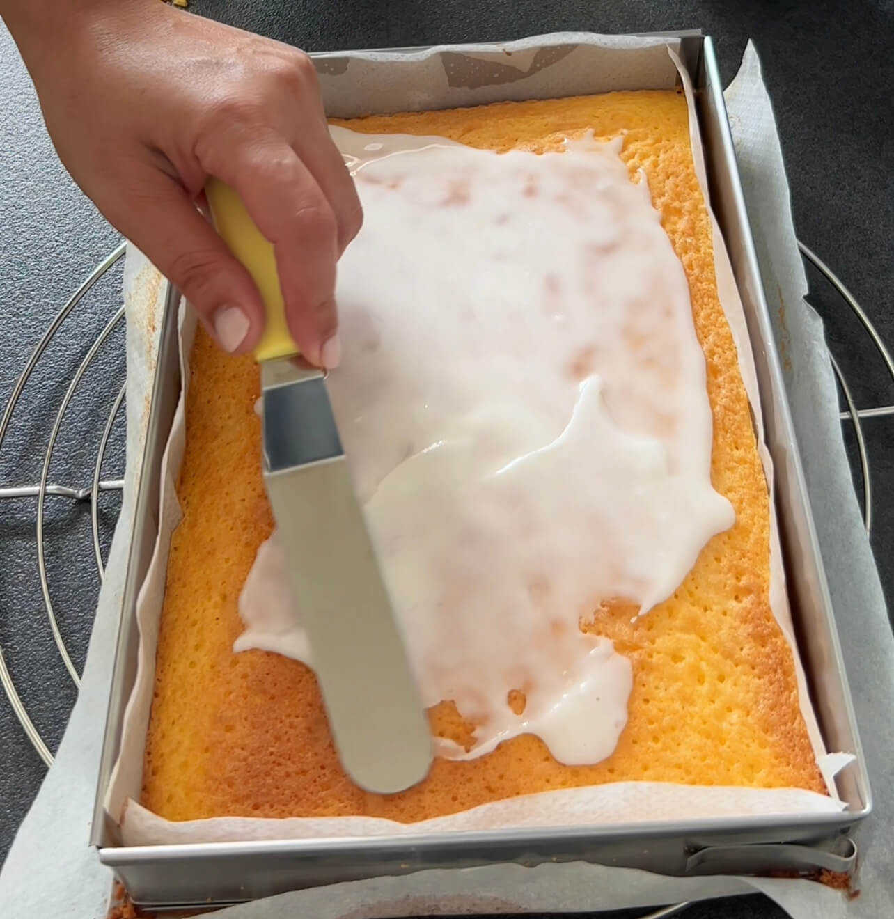 Image of Evenly spread the lemon glaze over the cooled Lemon Pieces.