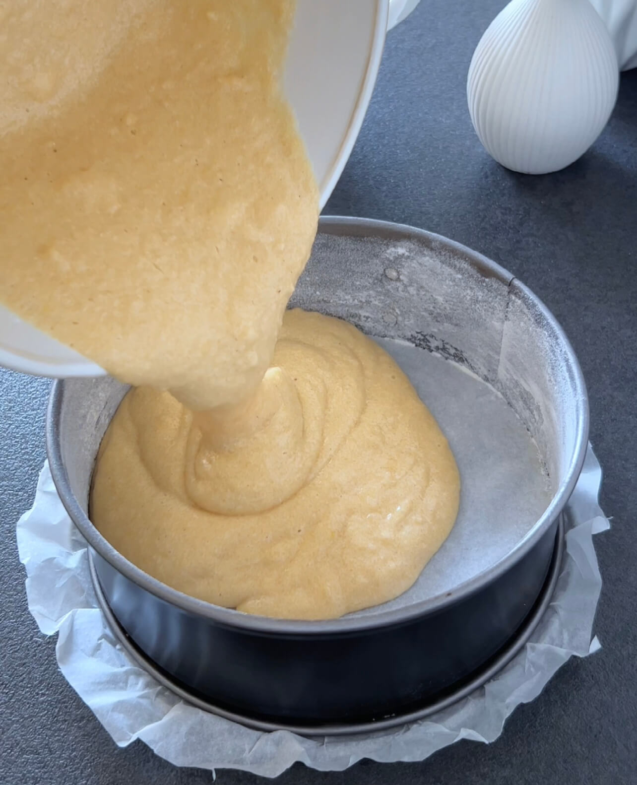 Image of Pour the batter into the prepared baking pan and smooth...