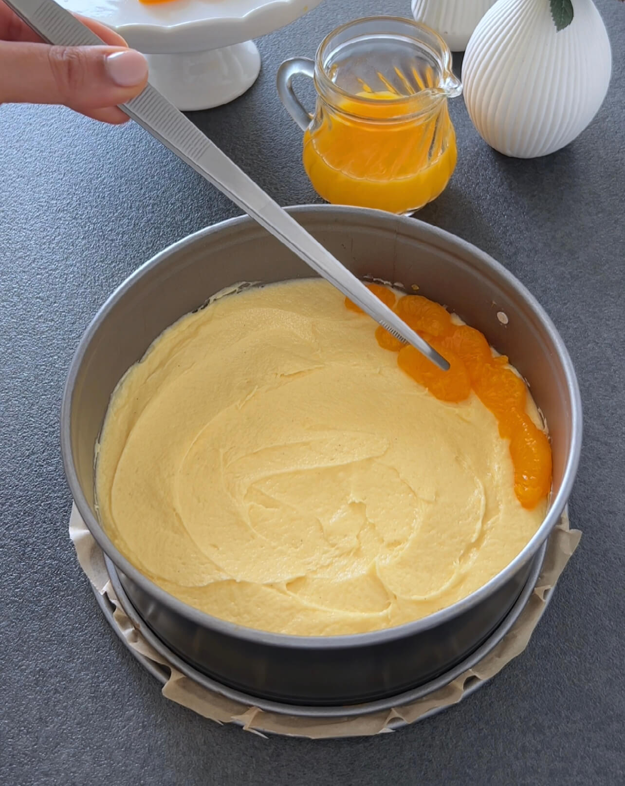 Image of Spread the drained Tangerines on the dough.