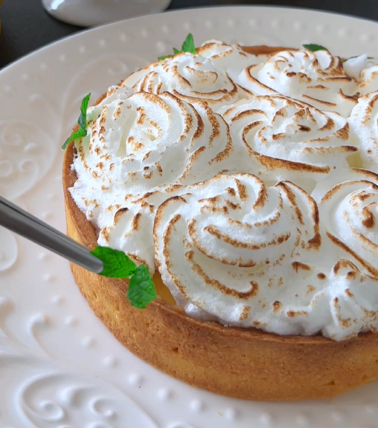 Image of Caramelize the meringue topping using a kitchen torch, adding that...