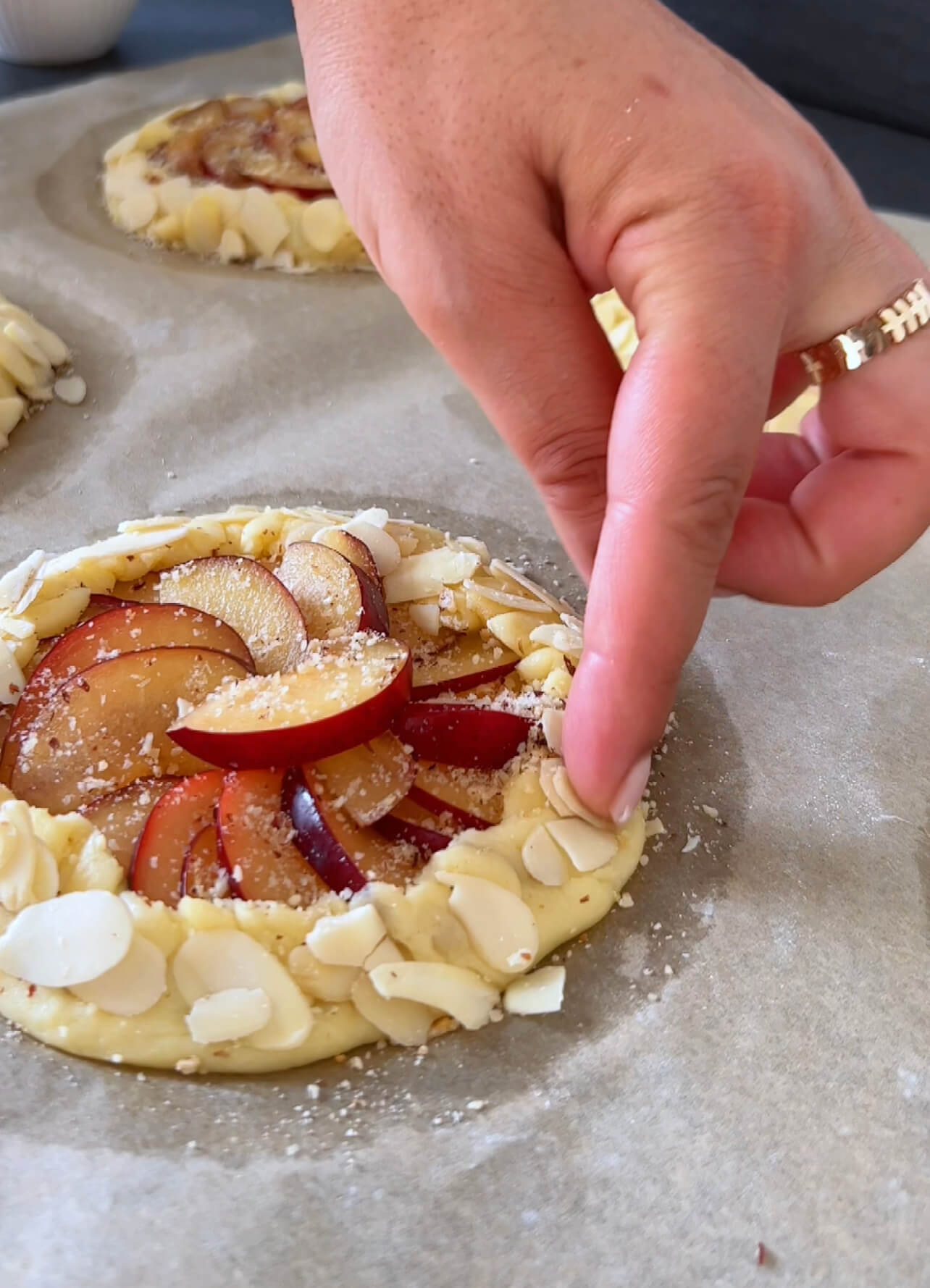 Image of Fold the edge of the dough over the plums and...