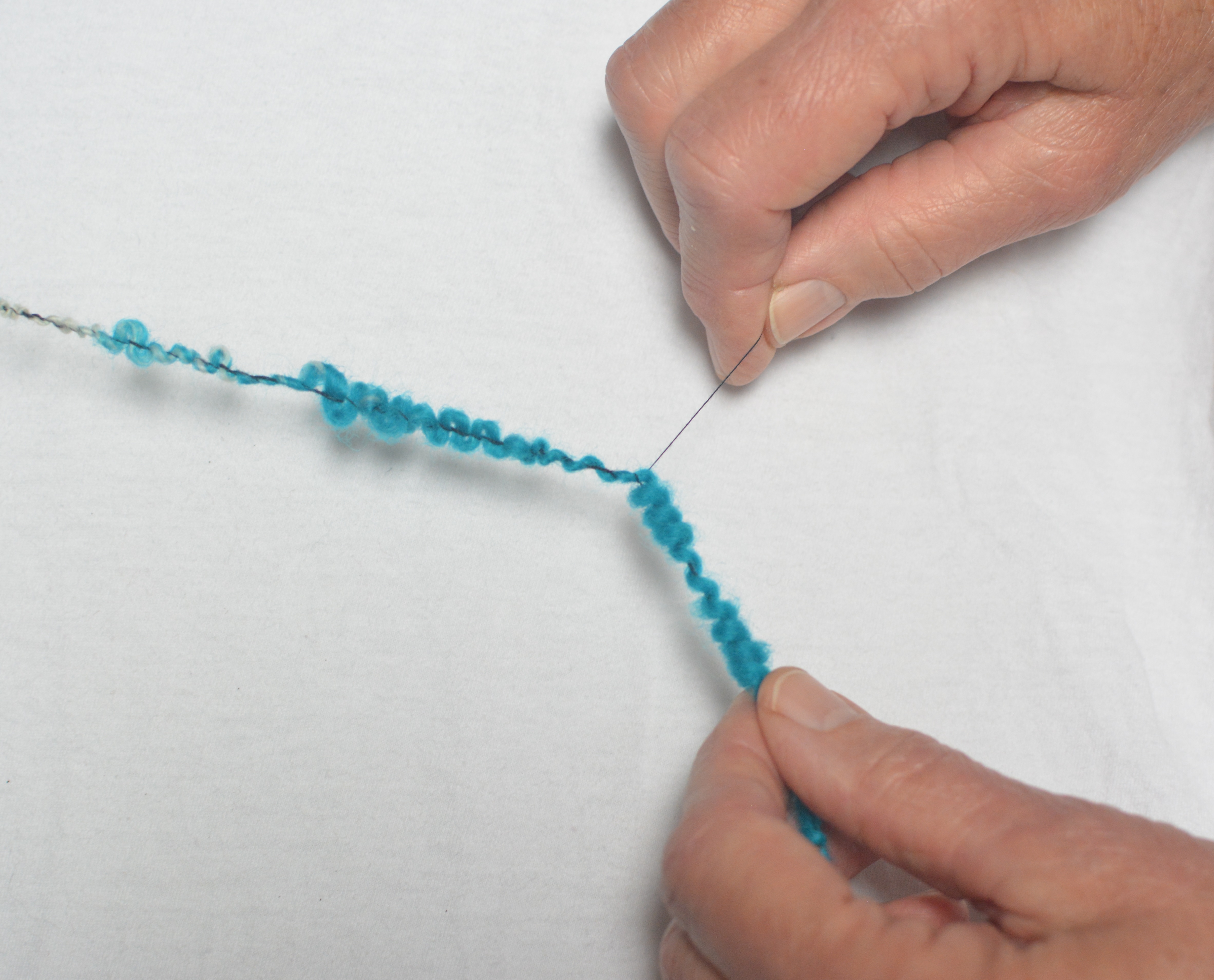 Image of Set up the looped yarn and the binding thread on...