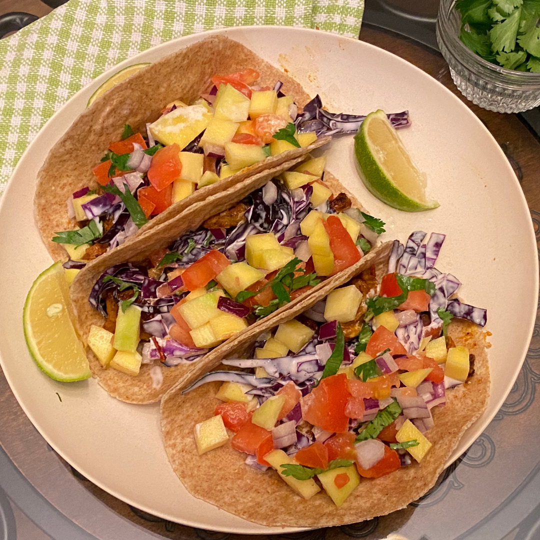 Image of Assemble the tacos! Divide the BBQ Chik-Un Tacos, purple cabbage...