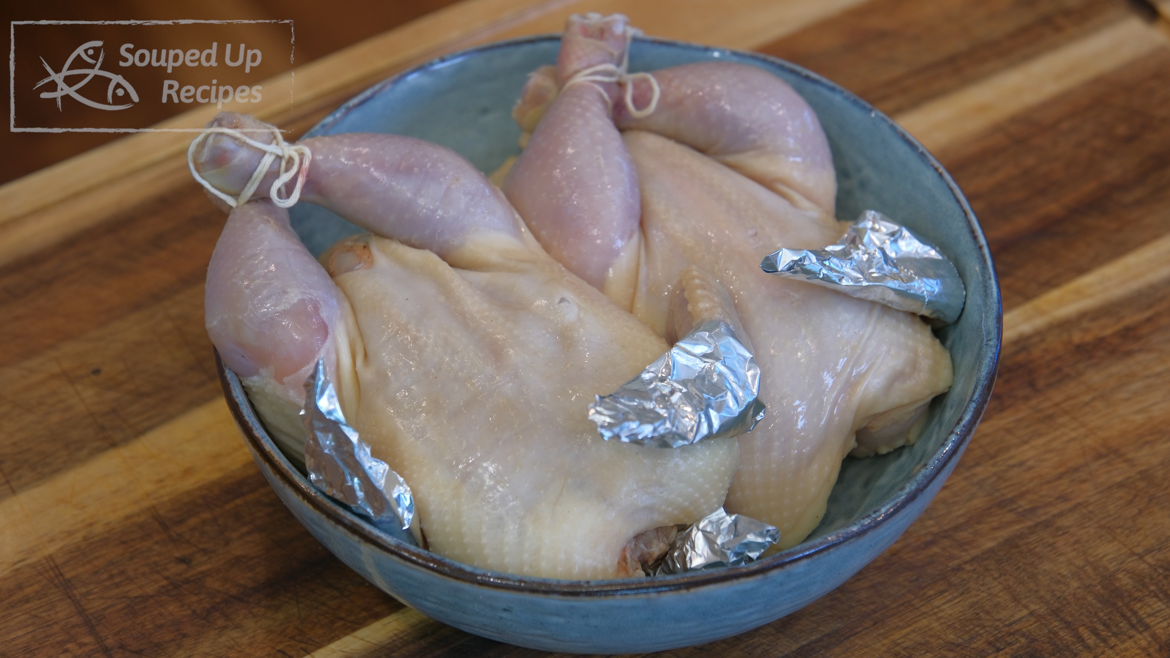 Image of Tie the chicken leg with kitchen twine and wrap the...