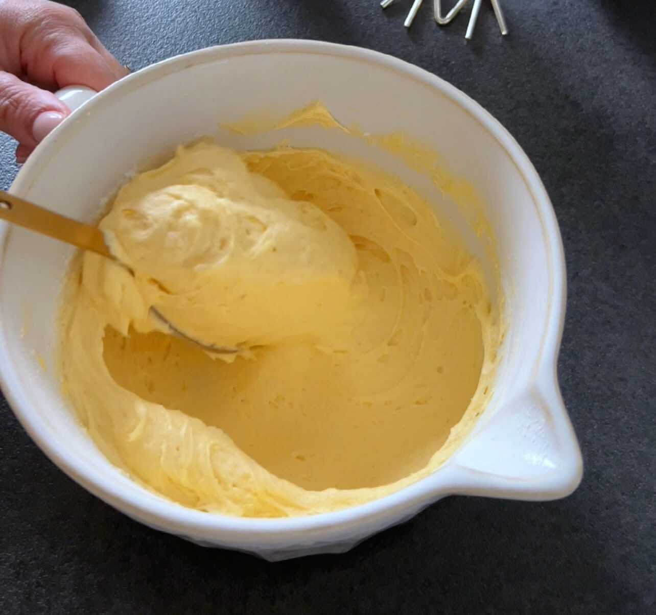 Image of In a bowl, cream the softened butter and sugar.