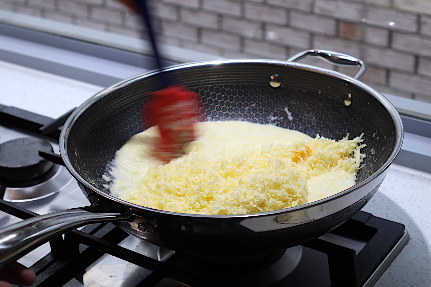 Image of add grated cheese and stir thoroughly until smooth 