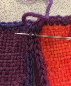 Image of Using a tapestry needle, sew squares together by picking up...