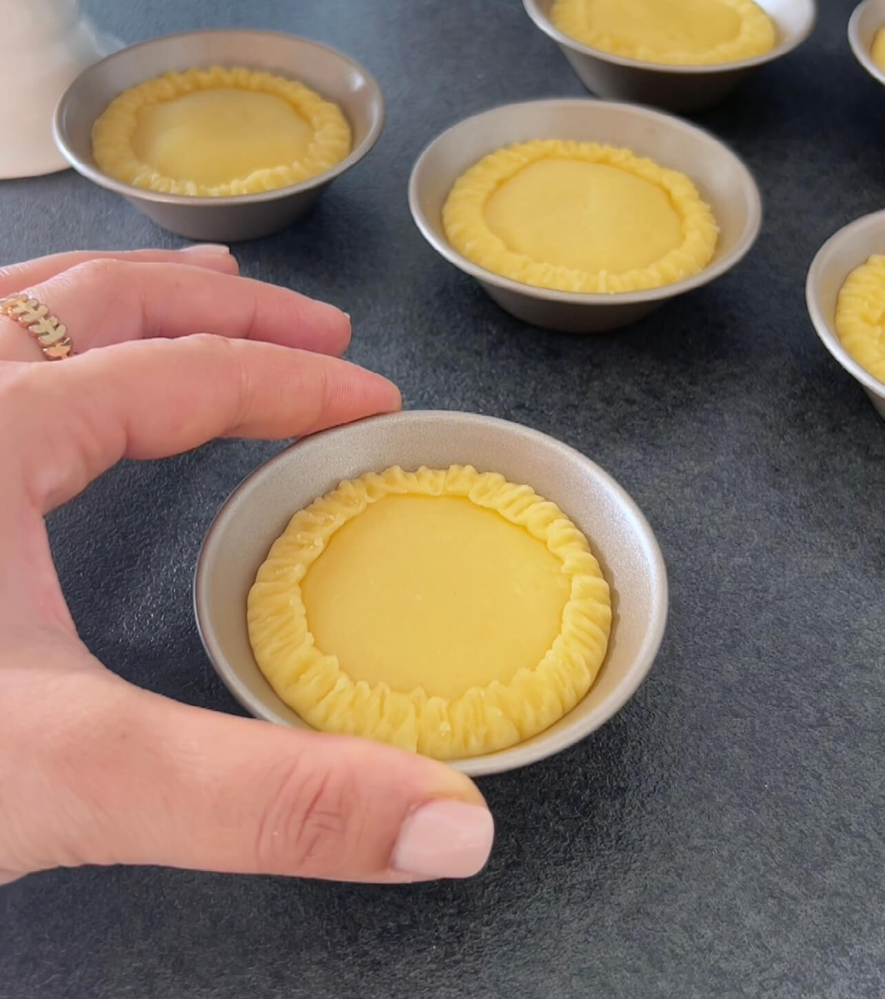 Image of Cut lids from the remaining dough and place them over...