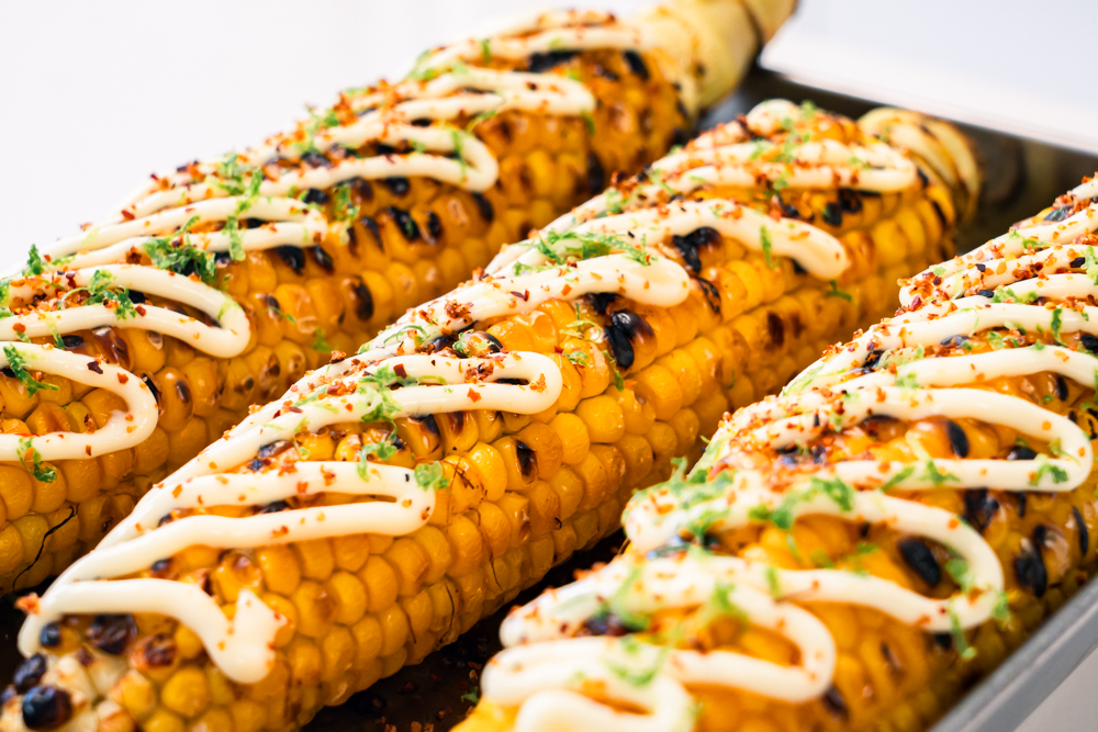 Grilled corn with mayo, lime and tajin