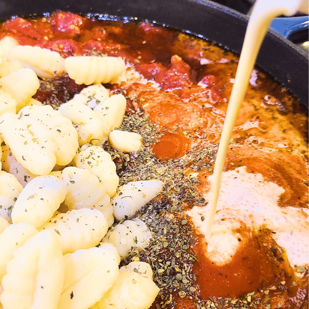 Image of Add uncooked potato gnocchi, heavy cream, and tomato sauce to...