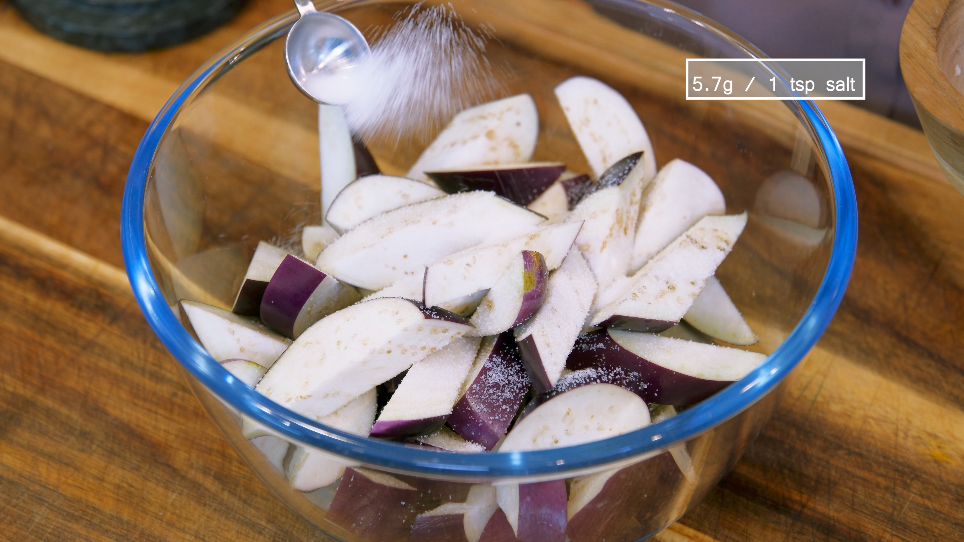 Image of Add the eggplant and 1 tsp of salt to a...