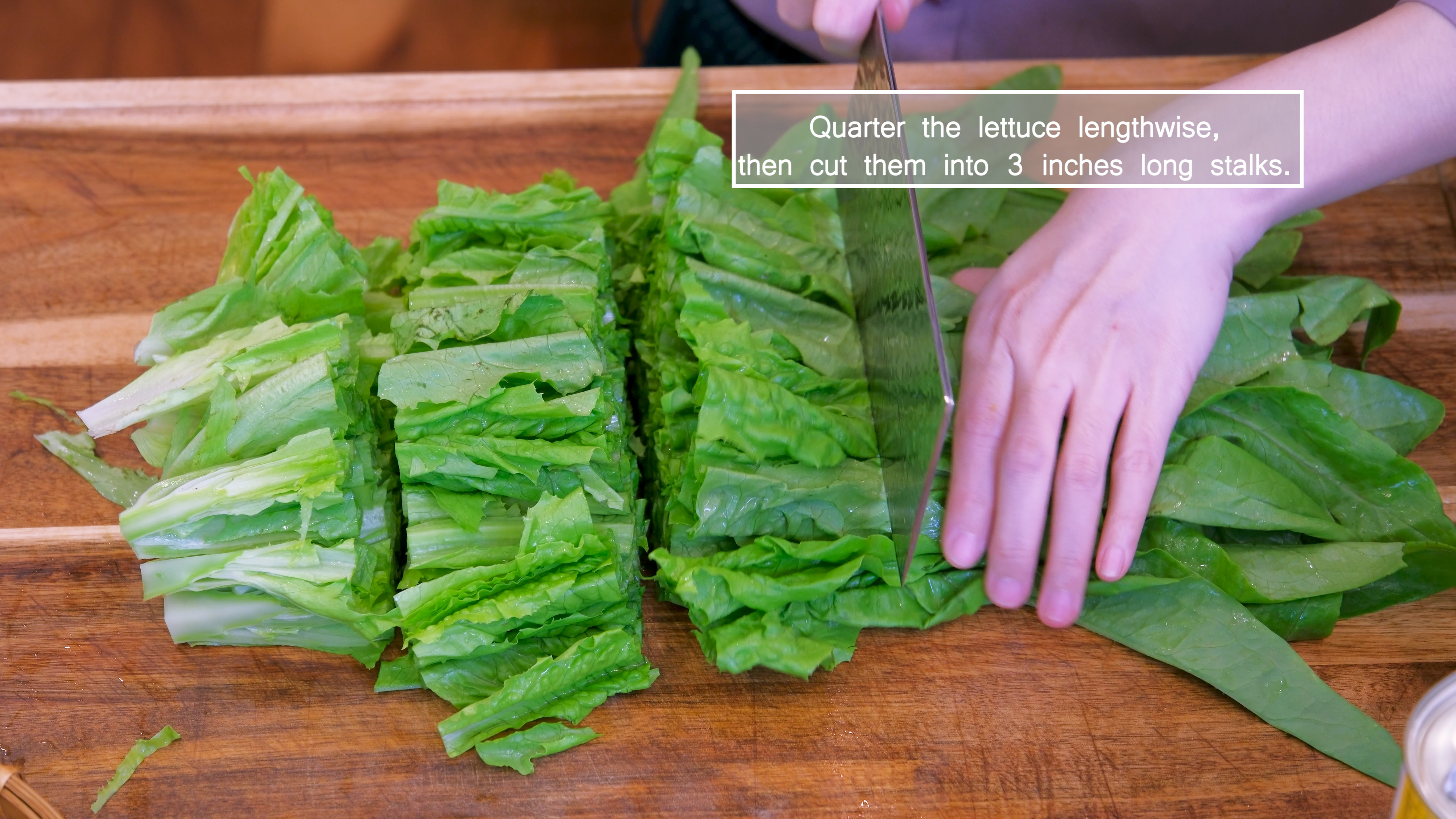Image of Quarter the you mai cai lettuce lengthwise, then cut it...