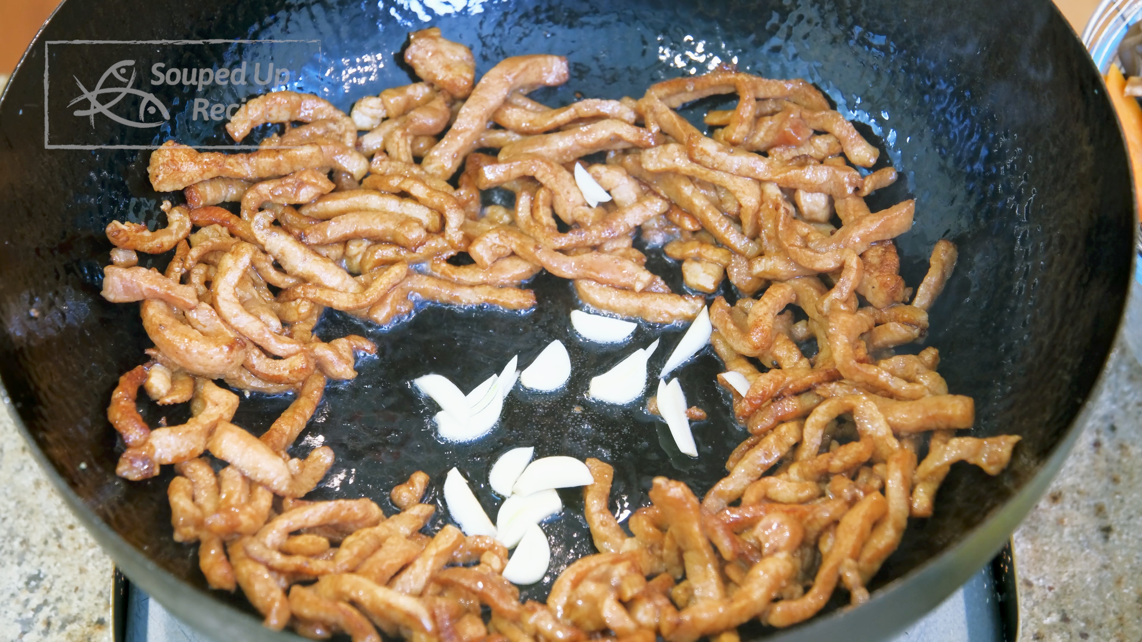 Image of Add the garlic slices and stir until fragrance, which will...