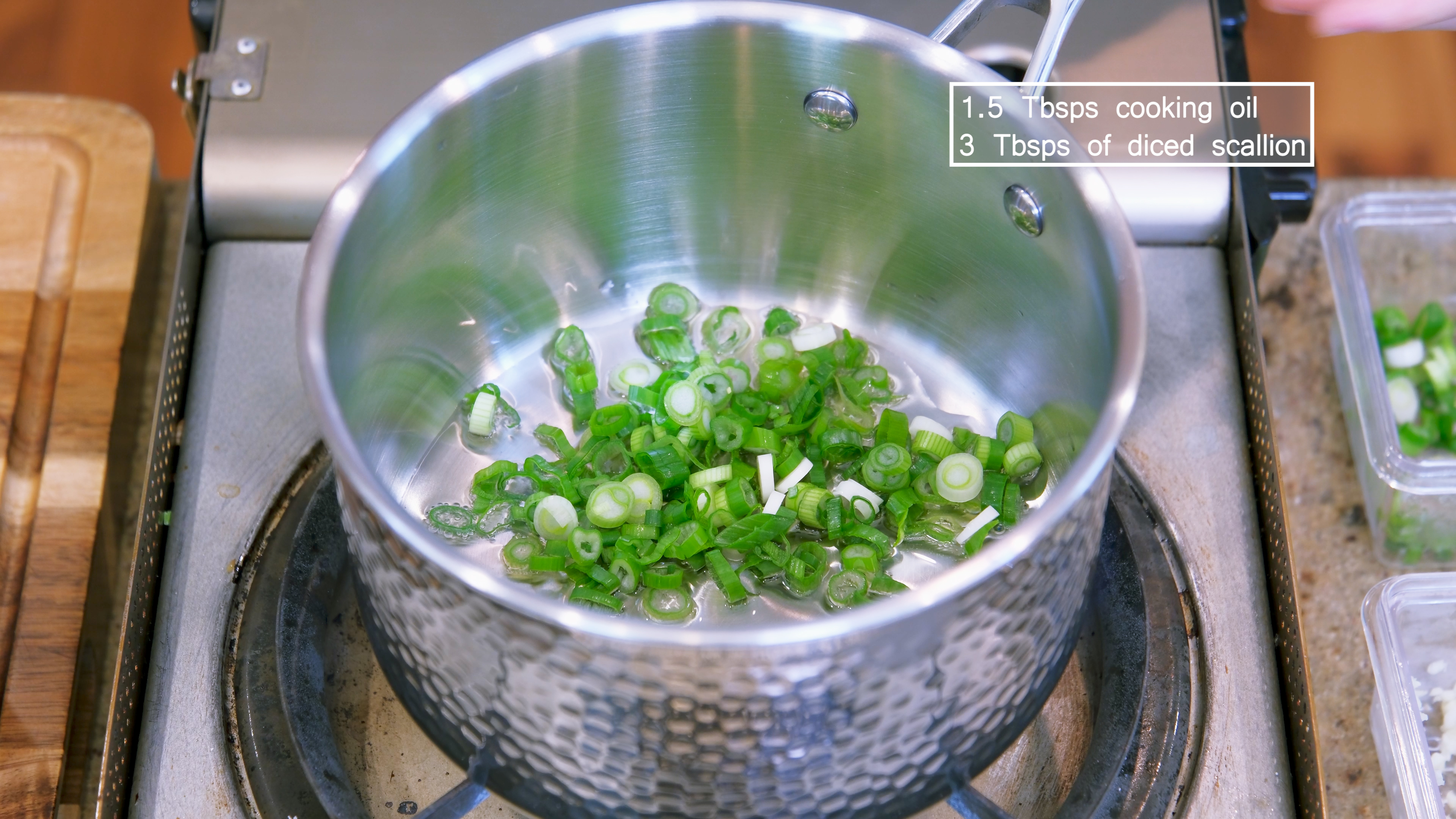 Image of Add oil and diced scallion to a saucepan and stir...