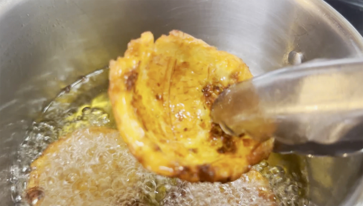 Image of Add plantain bowls back into the oil in batches and...