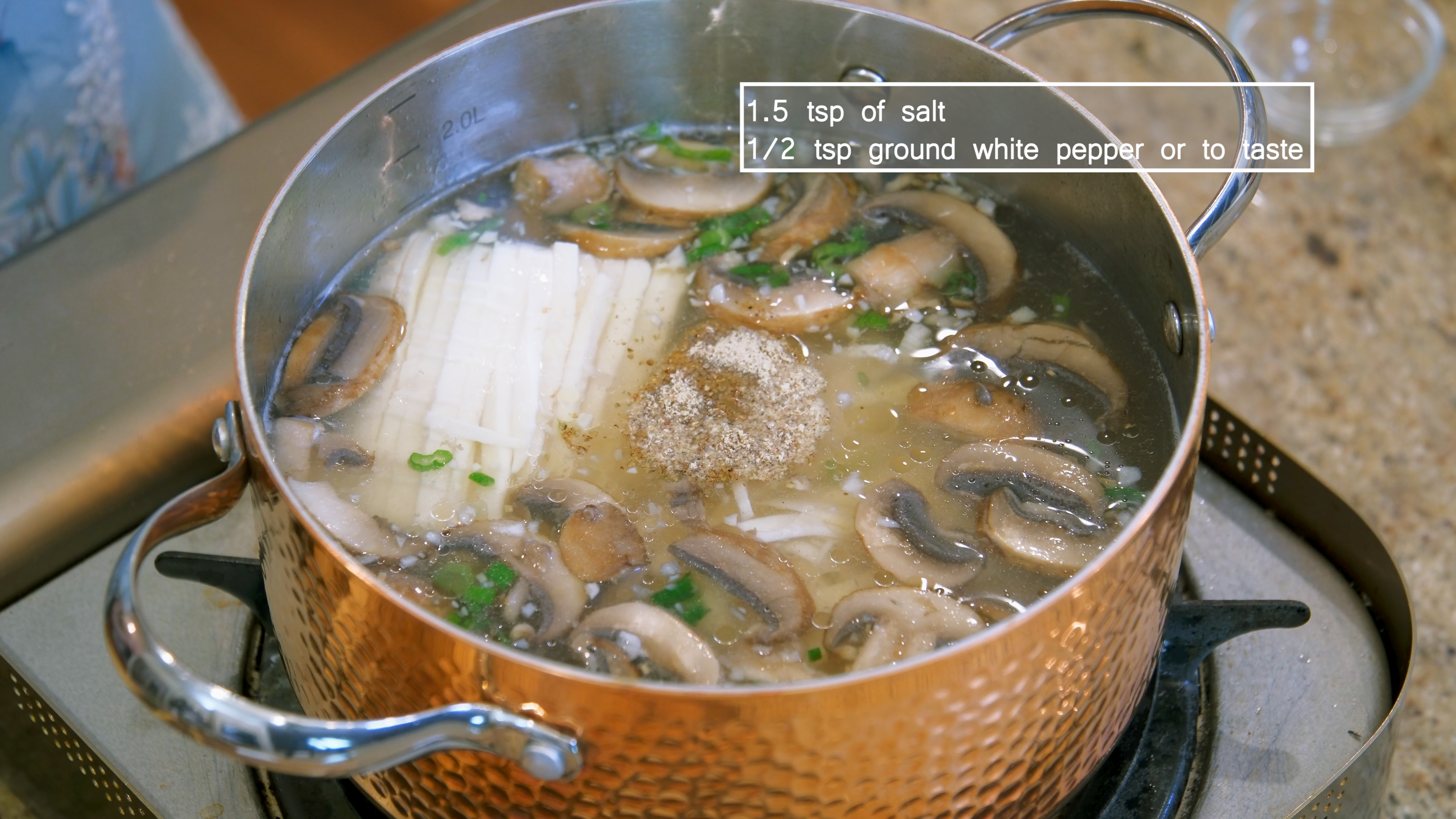 Image of Add the tofu to the pot and season the soup...