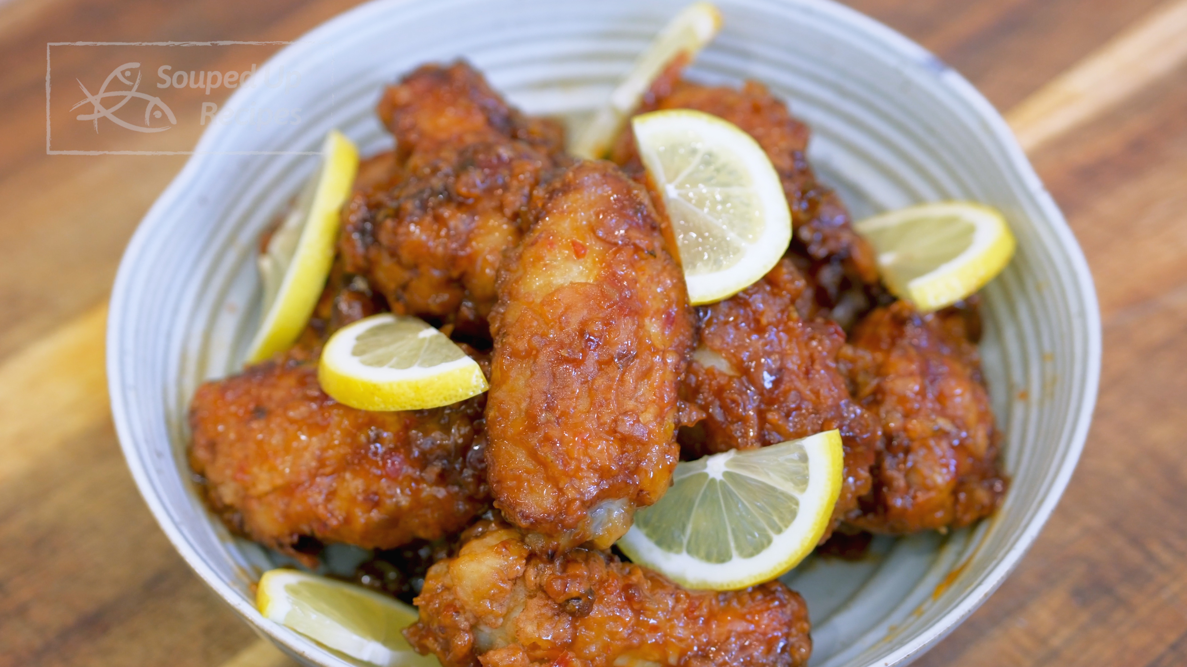 Image of Put some lemon slices next to the wings for garnish.
