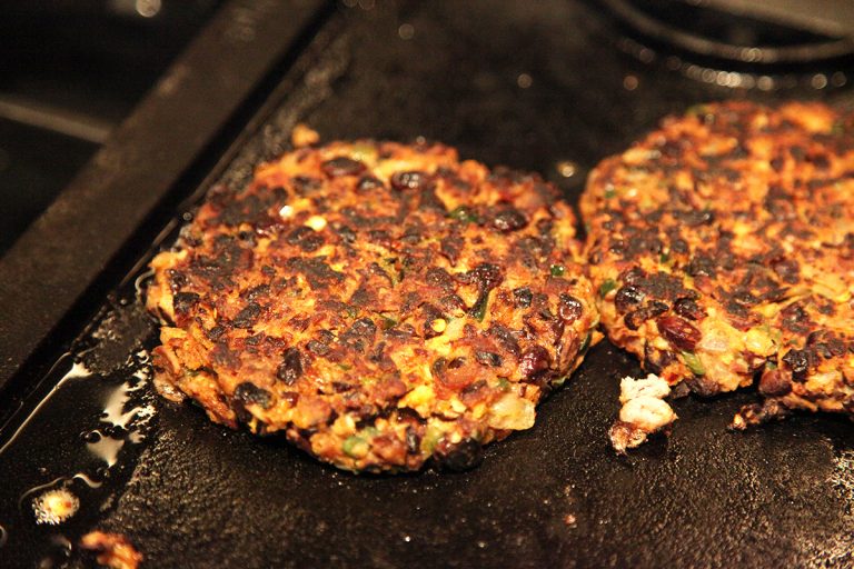 Image of Griddle black bean patties over high heat on the skillet