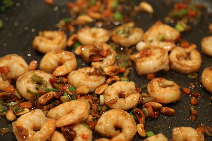 Image of Add in the shrimp, garlic and ginger and cook 5...