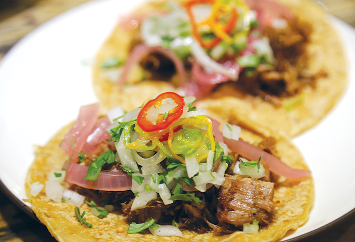 Image of I like carnitas tacos with onions and cilantro and fiery...