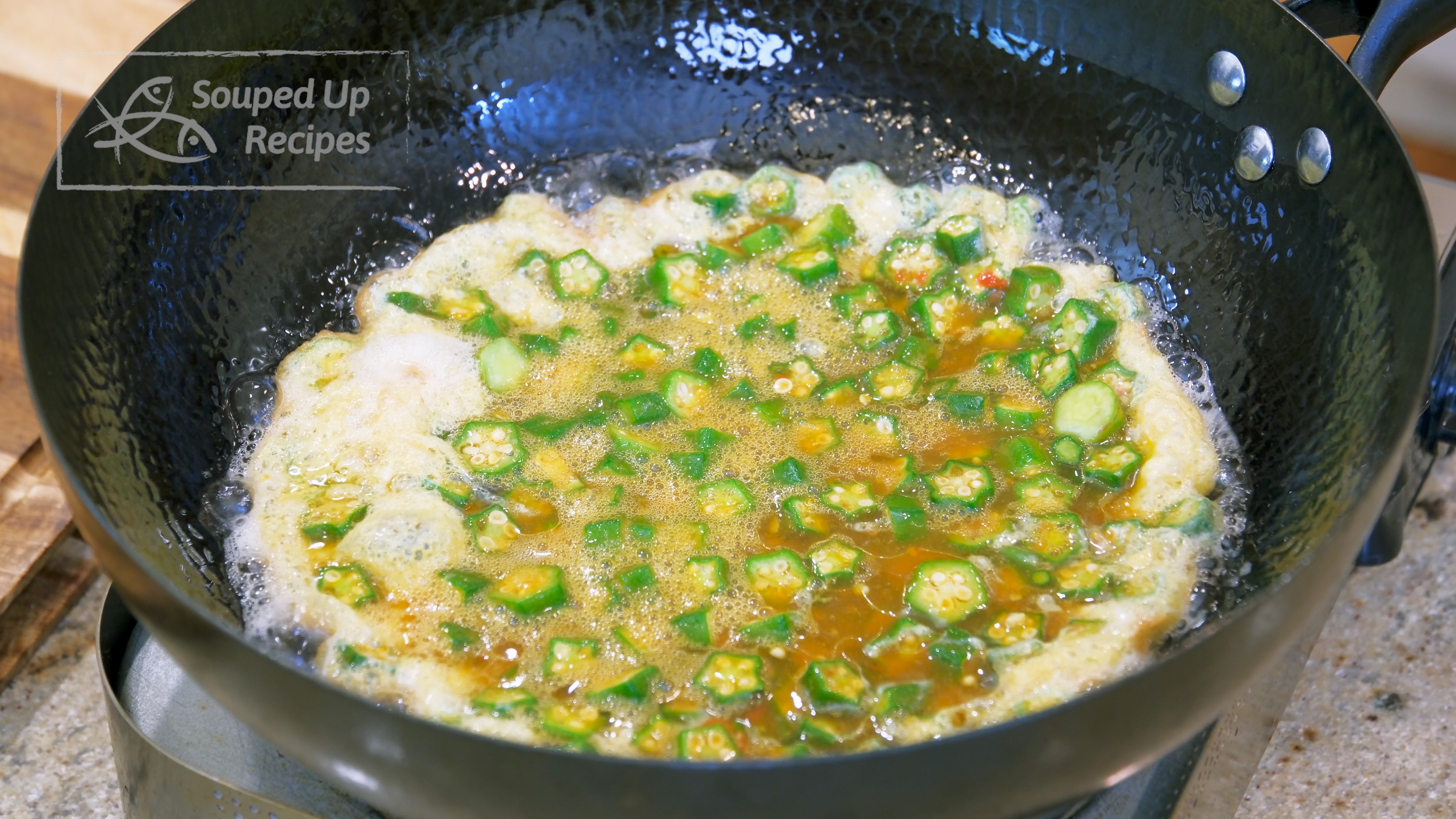 Image of Add the okra and egg mixture and wait for 10...