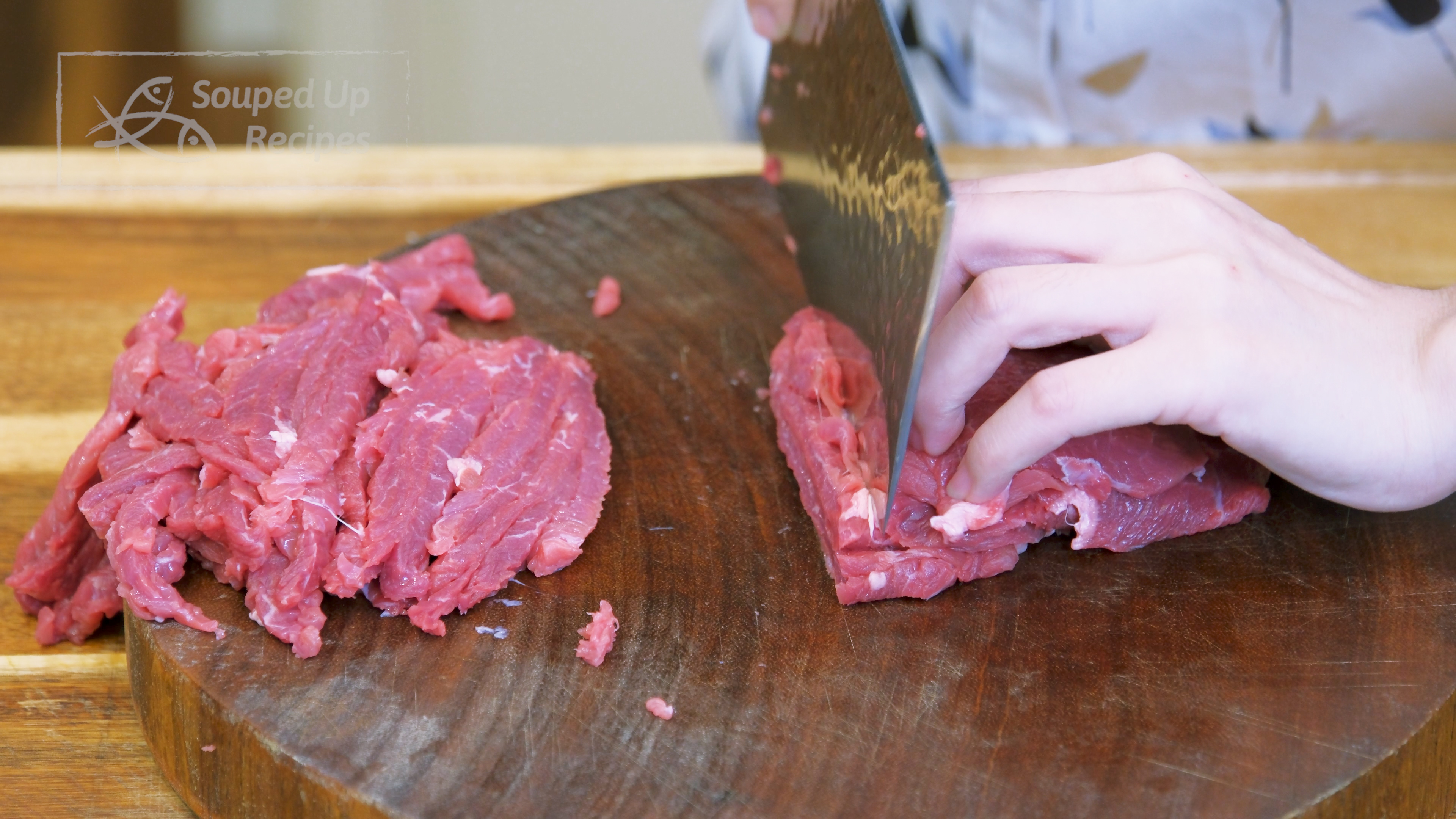Image of Slice the beef into 1/4-inch thick slabs, stack the slabs...