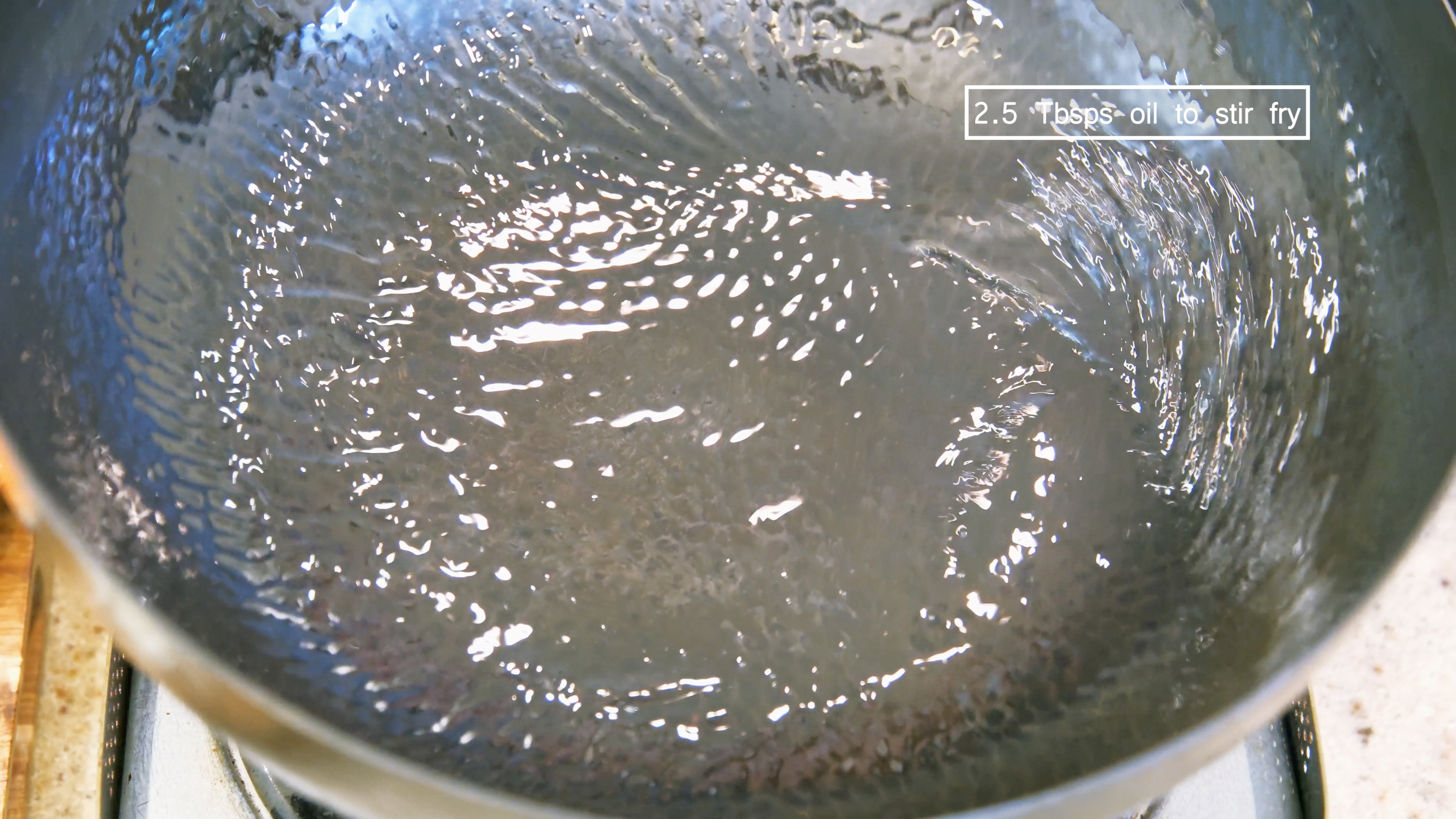Image of Turn the heat to high and heat the wok until...