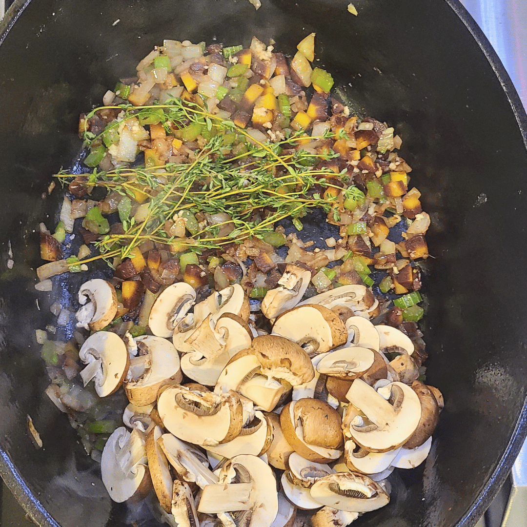 Image of Toss in the garlic, mushrooms and thyme. Continue cooking until...