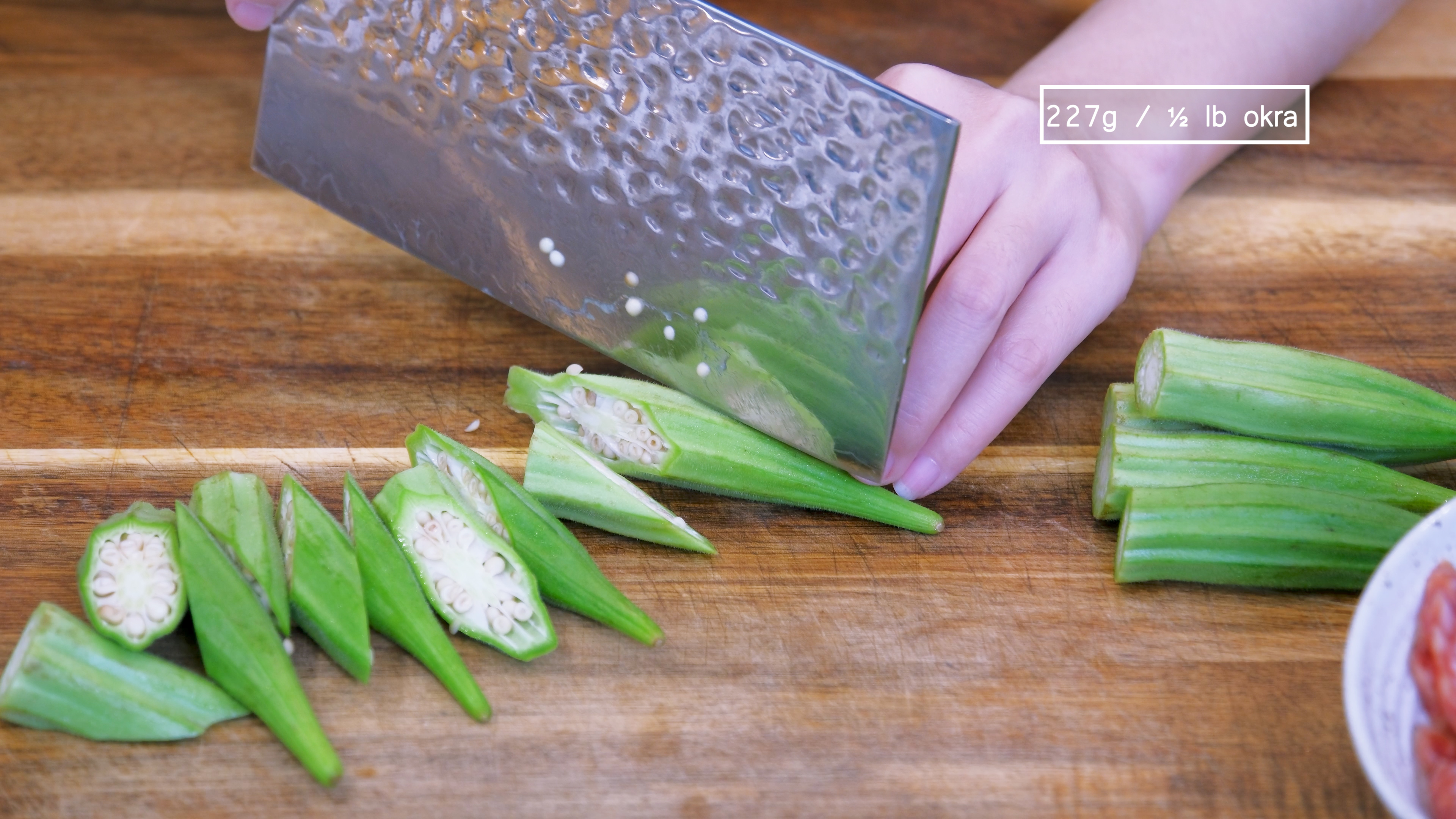 Image of Cut of the calyx of the of okra, then cut...