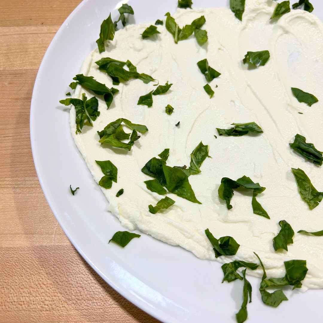 Image of Spread chilled herby Greek yogurt in a thin layer on...
