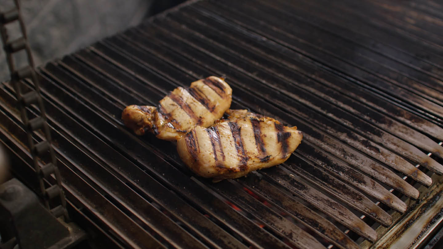 Image of Grill the chicken over direct heat until lightly charred, adjusting...