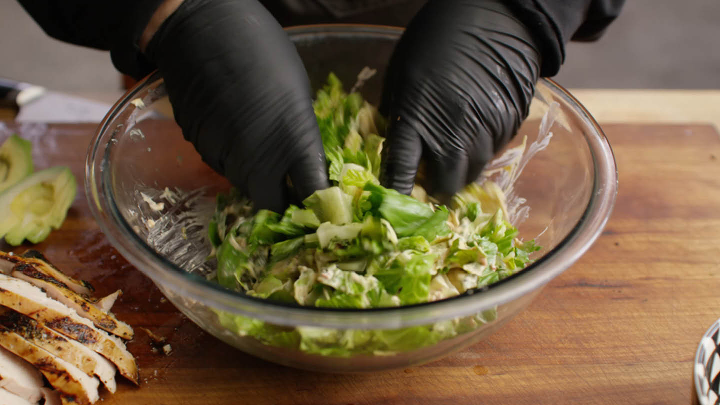Image of Place the sliced, charred and fresh Romaine in a large...