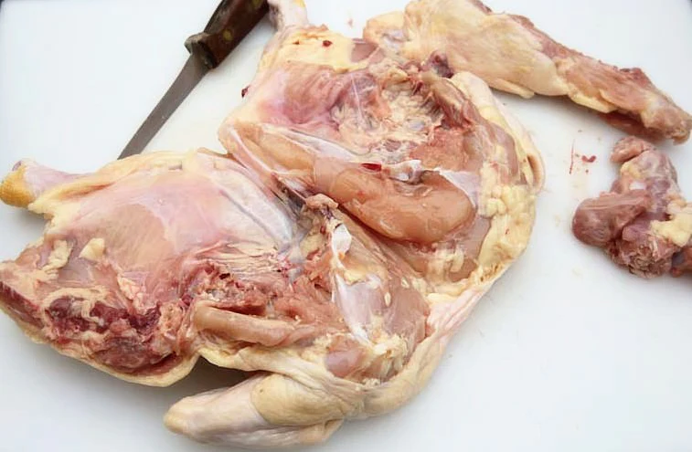 Image of The chicken is laid open as in an 