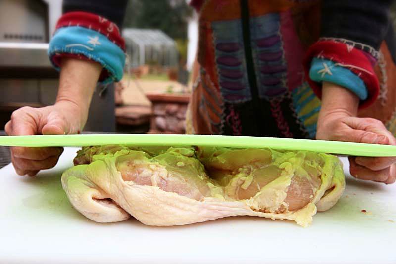 Image of Place the opened chicken between two cutting boards, and firmly...