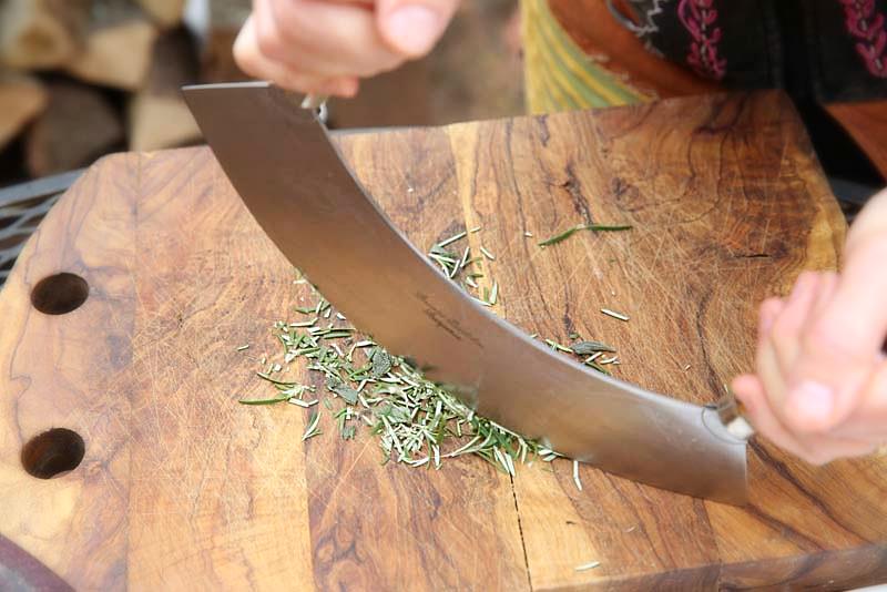 Image of A mezzaluna is a perfect tool for chopping fresh herbs.